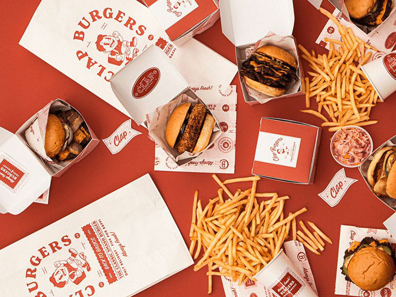 Hamburgers, French fries, and their packaging